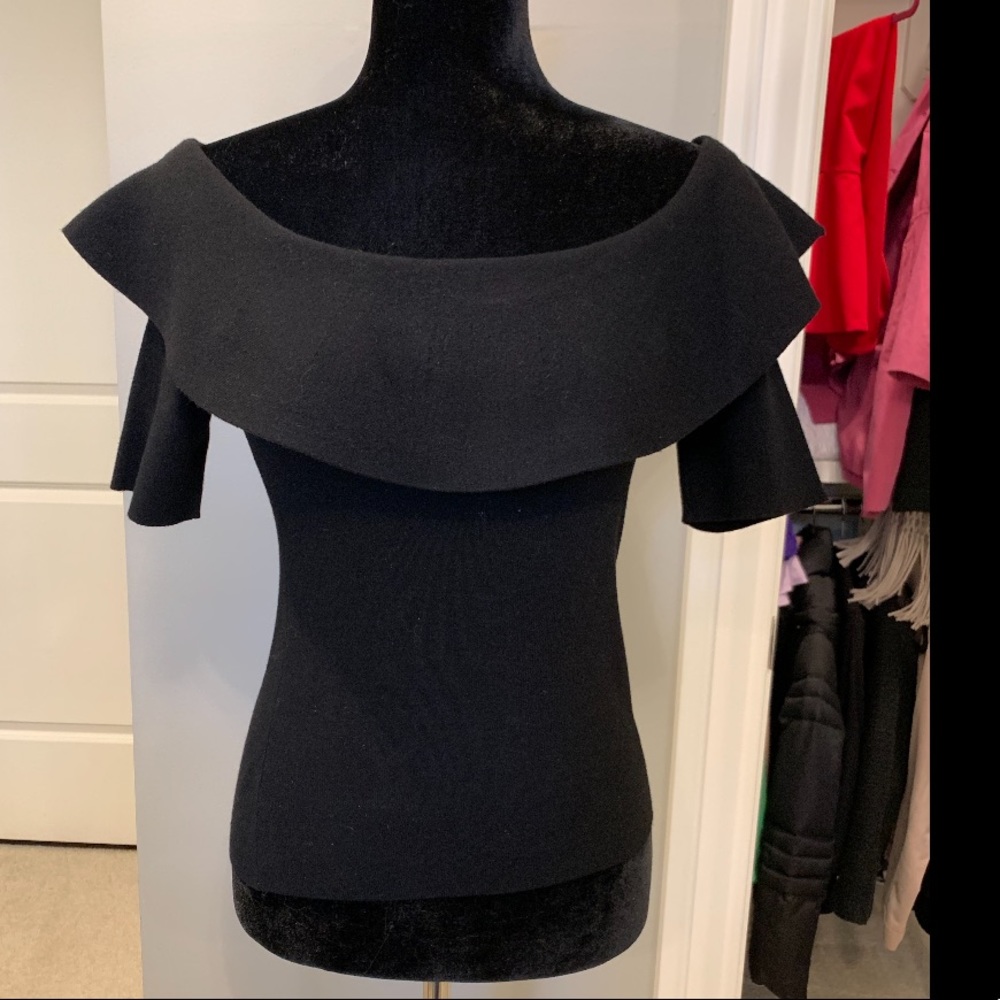 Black knit off shoulder top with ruffle detail